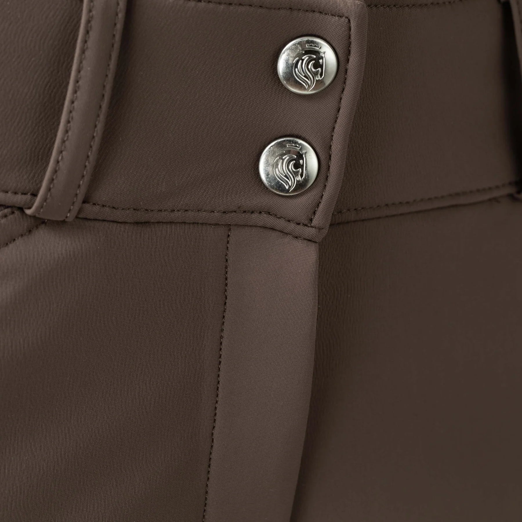 Closeup view of the Dark Brown Equinavia Maud Tech Knee Patch Breeches showing the waistband buttons