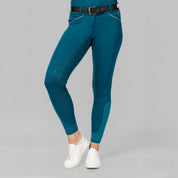 Front view of a female model wearing the Black/Glacier Blue Equinavia Estelle Hand Beaded Belt over petrol breeches on a plain background