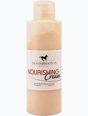 Tan bottle of boot cream with white label on plain white background