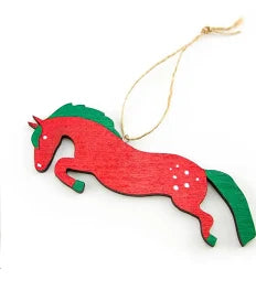 Green and red jumping horse wooden ornament with twine shown on plain white background
