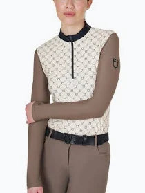 Cream printed long sleeved quarter zip top with tan sleeves shown on a model on a plain white background