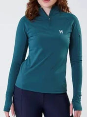 Teal quarter zip long sleeve base layer with logo shown on model in front of plain white background