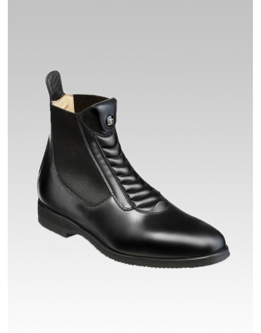 Smooth black leather ankle boot with elastic sides and stictched top shown on plain light grey background