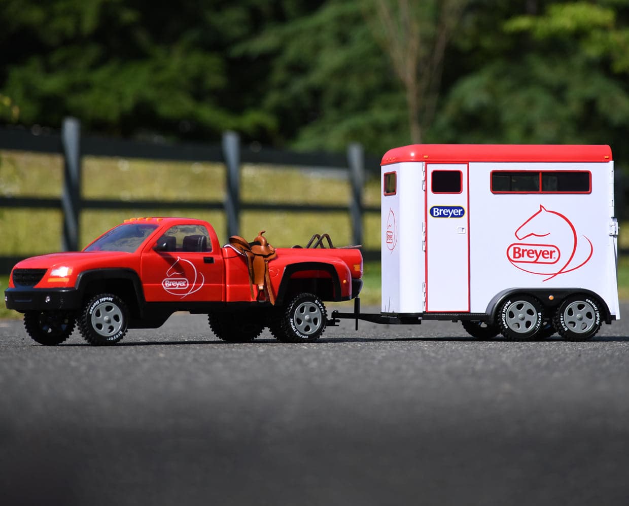 View of the Breyer Traditional Series "Dually" Truck hauling the Breyer Traditional Series Two-Horse Trailer on a road 