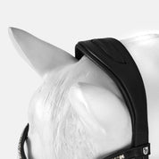 Close-up view of the poll of a white horse mannequin wearing the black Horze Montrose Dressage Bridle on a white background