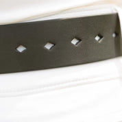 Angled back closeup view of a model wearing the the Equinavia Milli Diamonds Leather Belt showing the diamond-shaped notches
