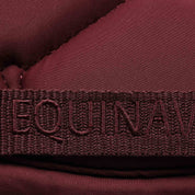 Close-up view of the girth keeper on the Burgundy Equinavia Bergen Crystal All Purpose Pad