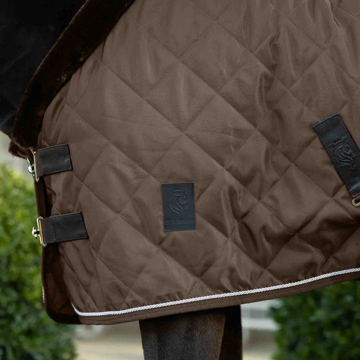 Brown fabric quilted stable blanket with faux fur neck lining shown on horse