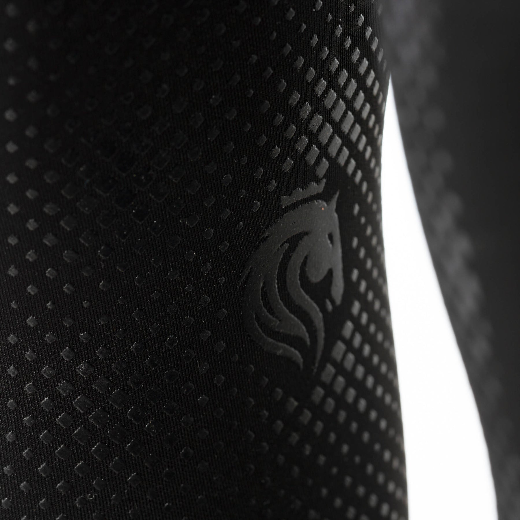 Close-up view of the silicone grip on the Black Equinavia Astrid Winter Full Seat Breeches