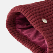 Interior view of the Spiced Apple Horze Anni Kids Knitted Hat on a plain background