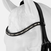 Close-up view of the poll of a white horse mannequin wearing the black Horze Montrose Dressage Bridle on a white background