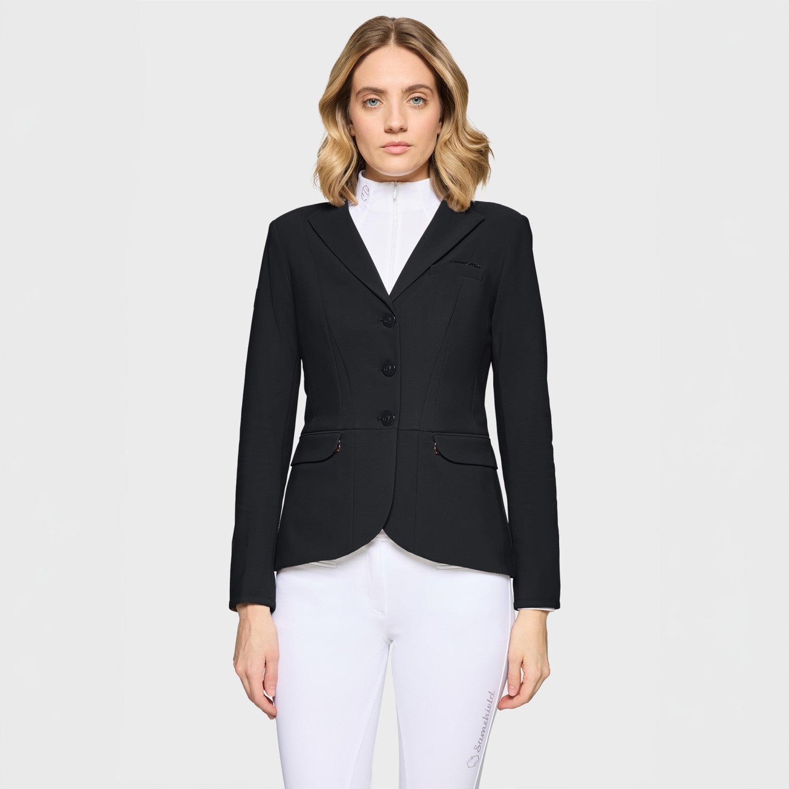 Front view of a female model wearing the black Samshield Victory Premium Show Jacket on a plain background