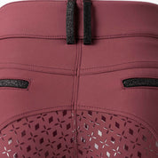 Back closeup view of the Burgundy Equinavia Kristina Full Seat Breeches on a plain background showing the belt buckle and silicone grip detail