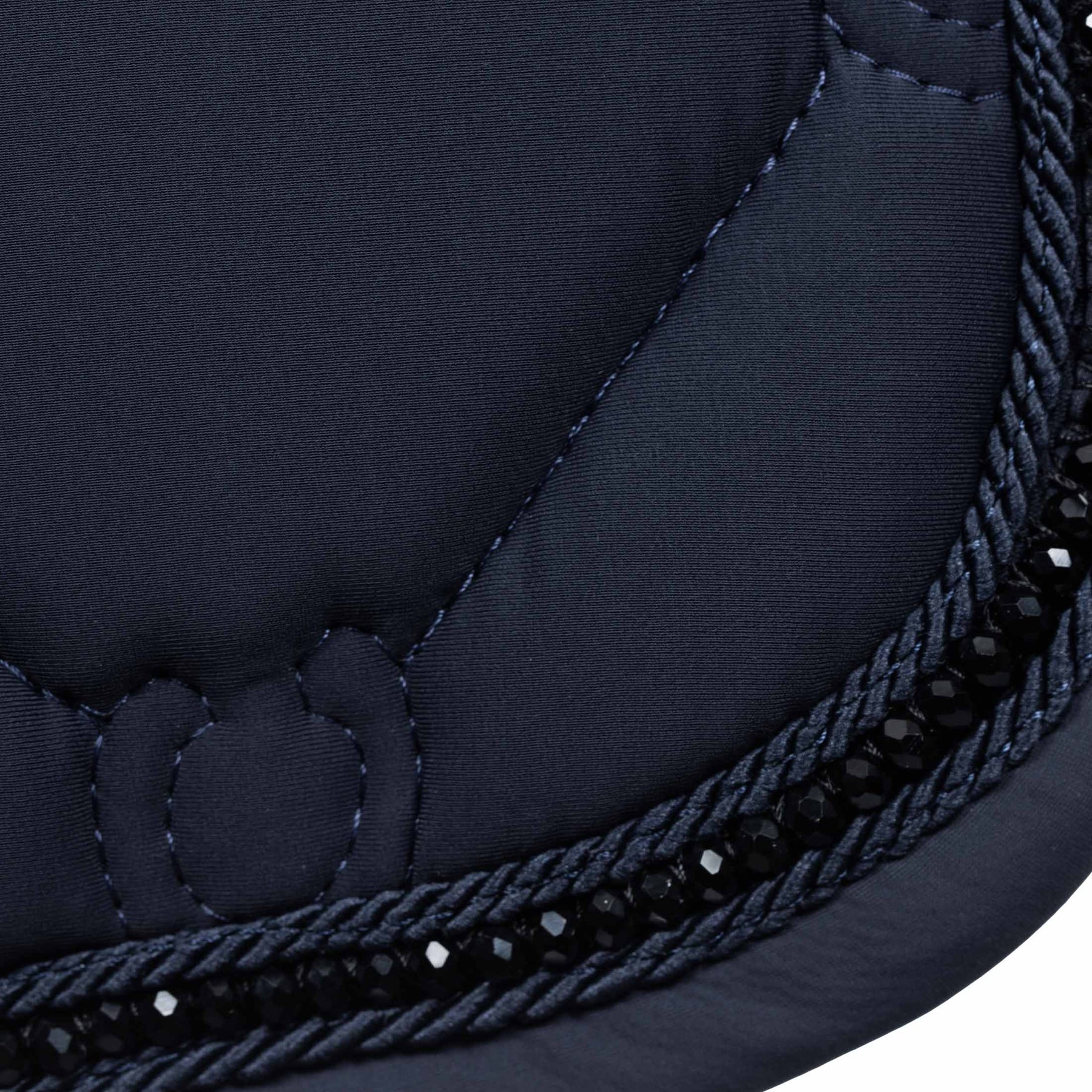 Close-up view of the blackrhinestone trim on the Navy Equinavia Bergen Crystal All Purpose Pad